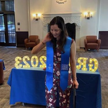 women wearing stole standing Infront of a table